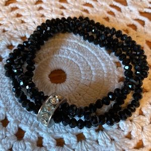 Bracelet, Black sparkly stones with a silver Wheel of Crystal
